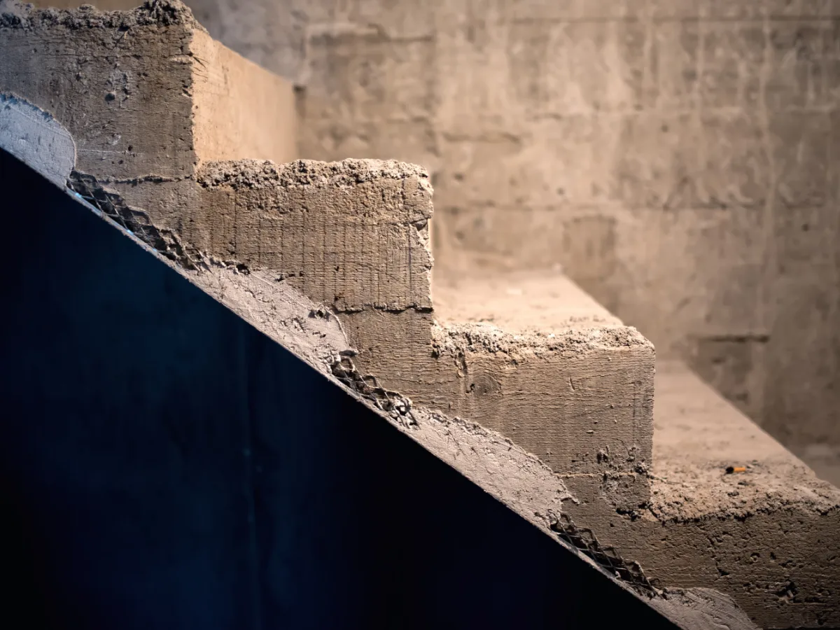 A poured concrete foundation and stair structure